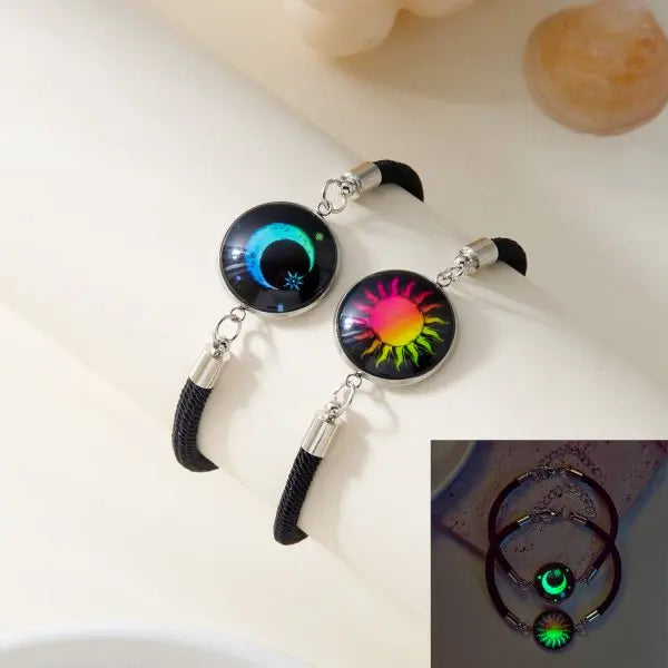 Pair of bracelets with colorful designs on a light background
