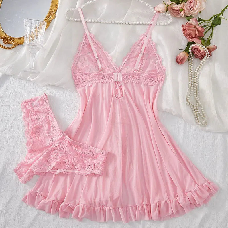 Soft pink lace nightdress and thong set styled on satin sheet